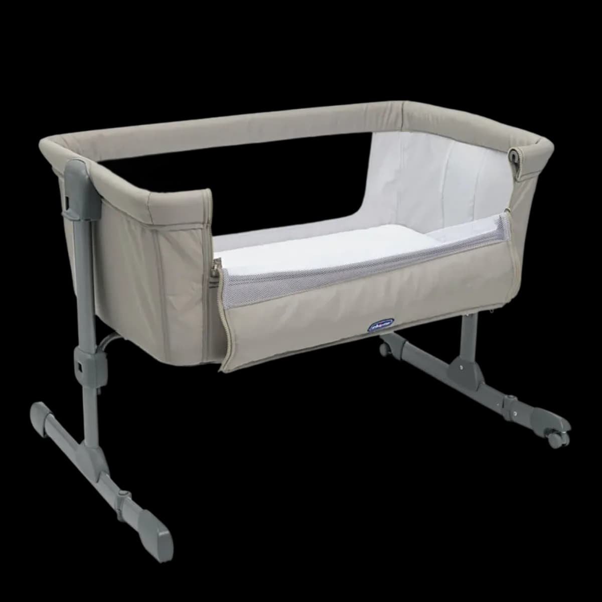 Chicco Next2Me Essential bedside crib in beige with the side panel lowered