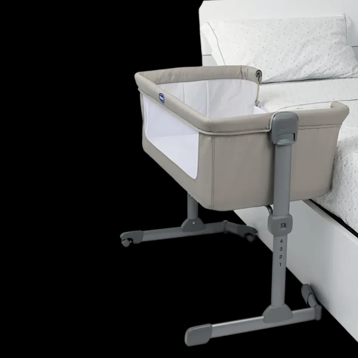 Chicco Next2Me Essential bedside crib fixed beside an adult bed